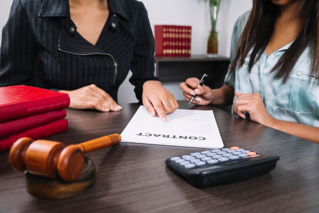 black-woman-pointing-document-near-lady-with-pen-table-with-calculator-gavel_23-2148042590.jpg книги